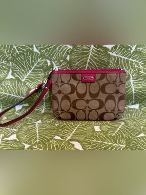 Coach Khaki Signature
Canvas Wristlet with Pink Trim